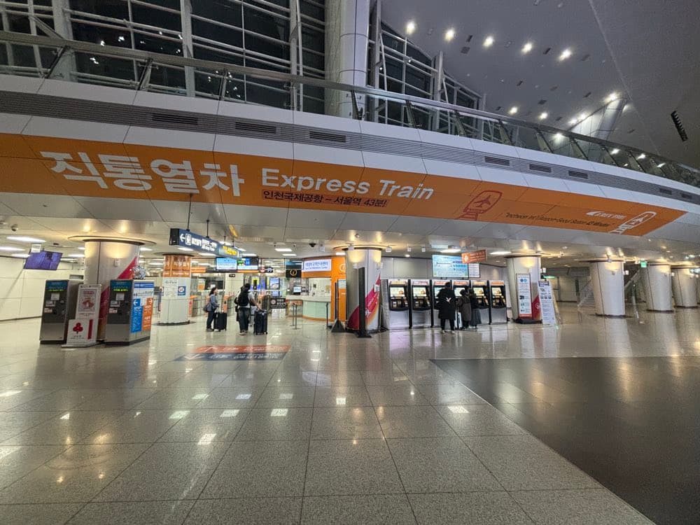 The AREX Express ticketing area on B1 of the Terminal 1 Transportation Center, under the "Express Train" banner, with ticket machines